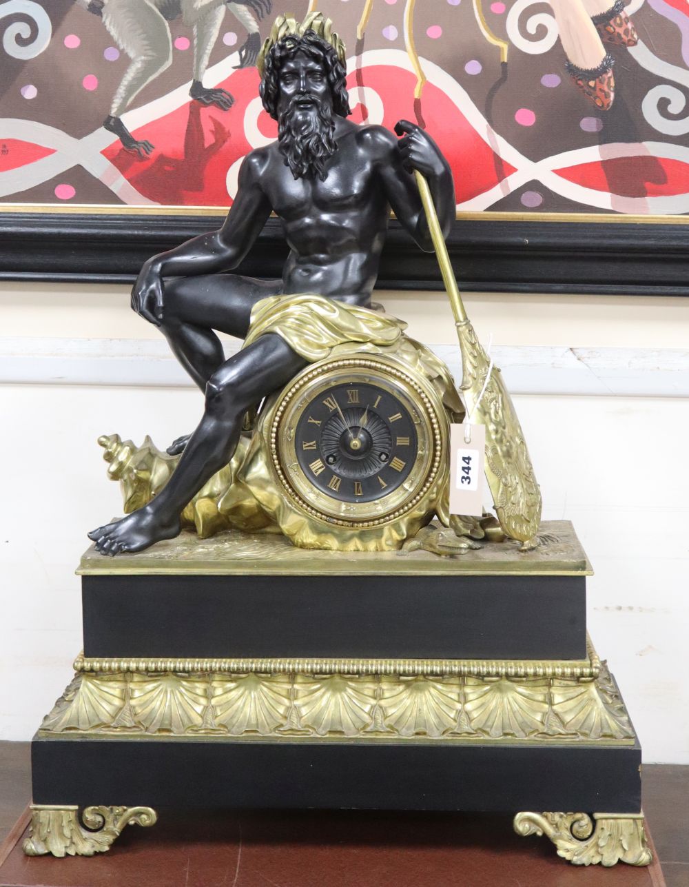 A 19th century French bronze-mounted mantel clock surmounted by the seated figure of Neptune, height 66cm
